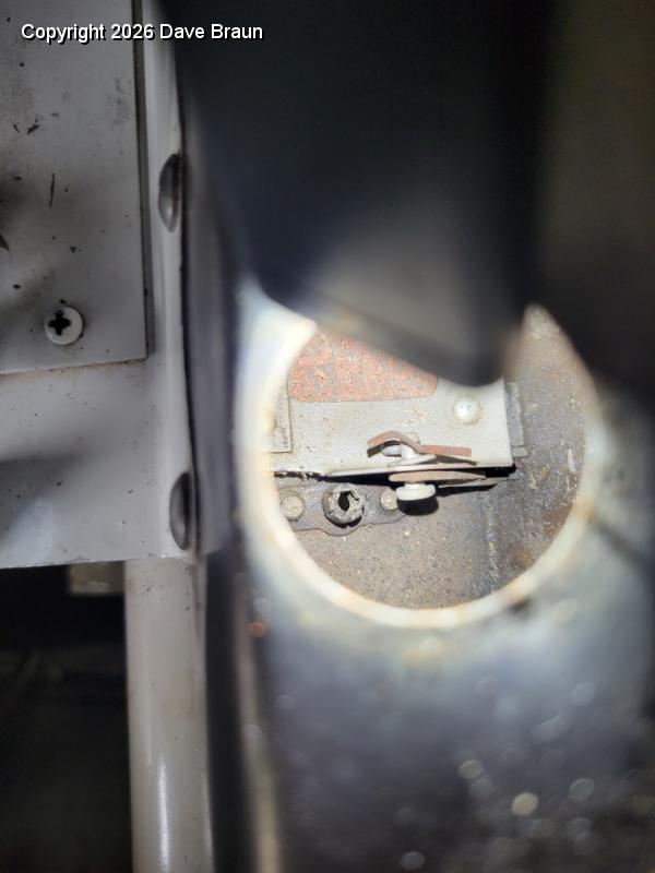 2024-03-07 14.36.56.jpg - The firewall shut off cable is attached through this one inch aperature. You have to get the cable, washer, clevis pin and cotter pin all through the bell crank in the shut off flap.