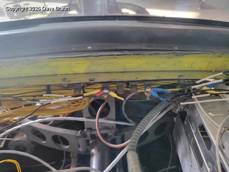 2024-10-23 17.13.54.jpg - The ground bus to bring all the voltage potentials to one level. This prevents ground loops which could back feed into the comms. I used an old bus from a set of circuit breakers to fashion it, and attached it to the aft cowl lip.