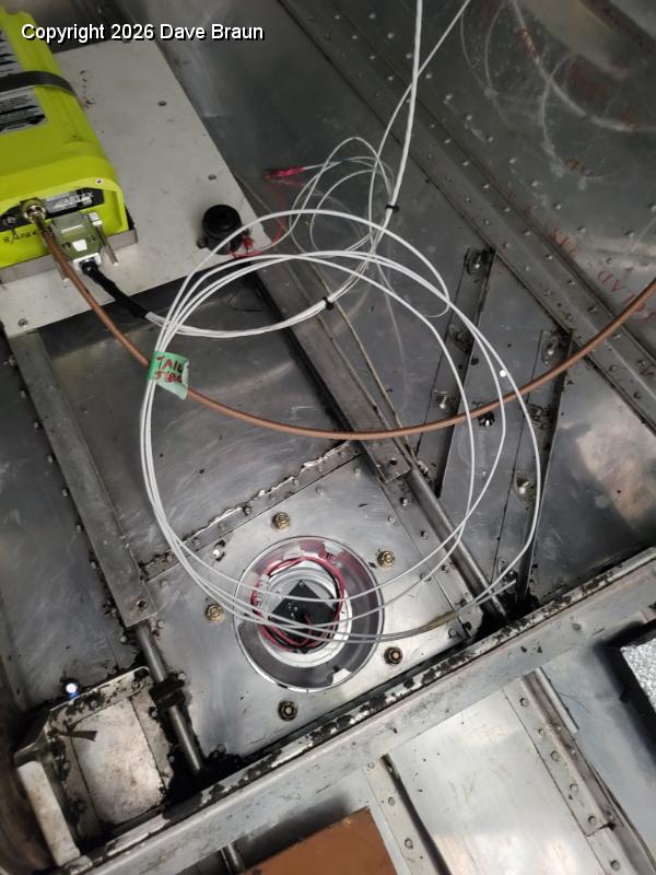 2024-02-05 16.17.59.jpg - Tail strobe and tail light wiring including ground being brought forward. The beacon is mounted in the old strobe housing. All Chip's lighting grounds are going to a central ground bus.