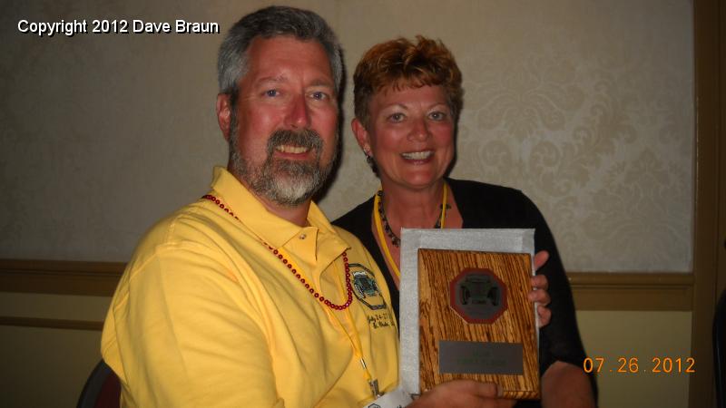 dscn7278.jpg - Diane Vinar and David Braun with Diane's First Place award MGB.