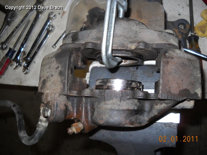Caliper disassemlby 02.jpg - This is the LH caliper. Notice the incorrect placement of the bleeder and brake hose.