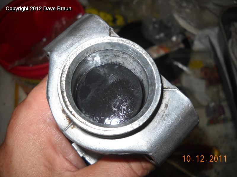 A rubber cup is after the valve assy.jpg - The seal goes in with the flange end down into the bore, as usual.