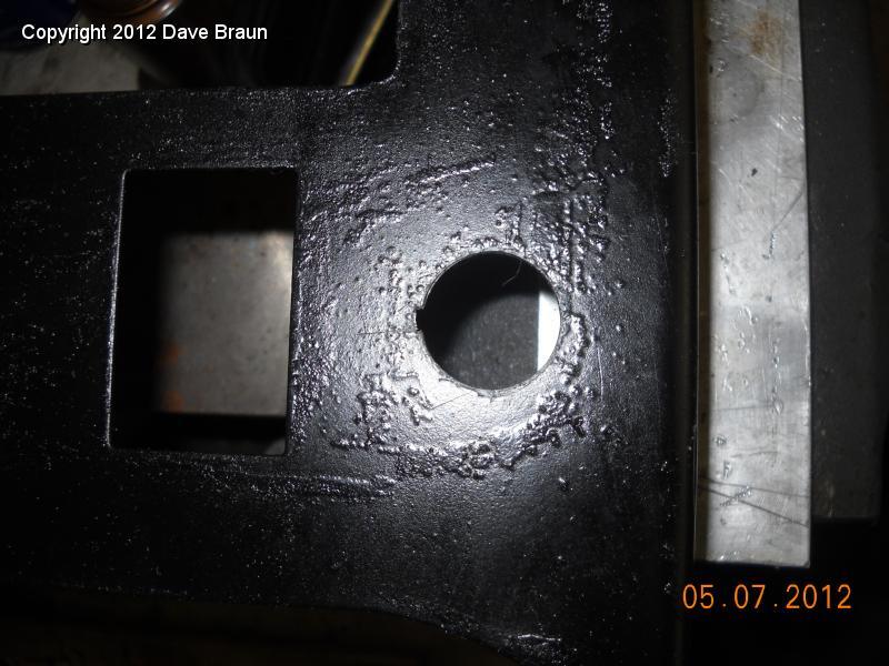 Filing holes to size for seat heaters after hole saw 2.jpg