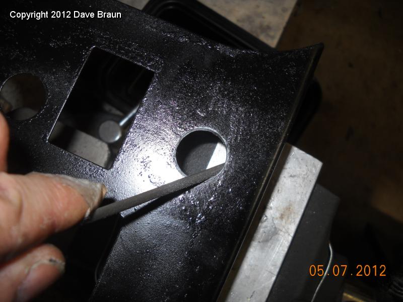Filing holes to size for seat heaters after hole saw.jpg