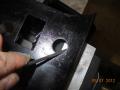 Filing holes to size for seat heaters after hole saw