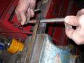 Filing weld material to make round hole
