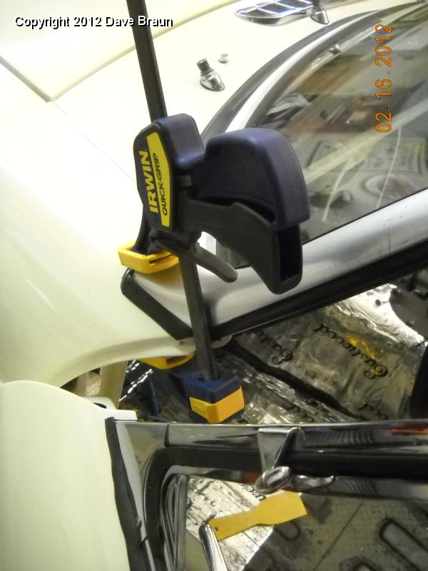 Clamping windscreen stanchion in place to align holes.jpg