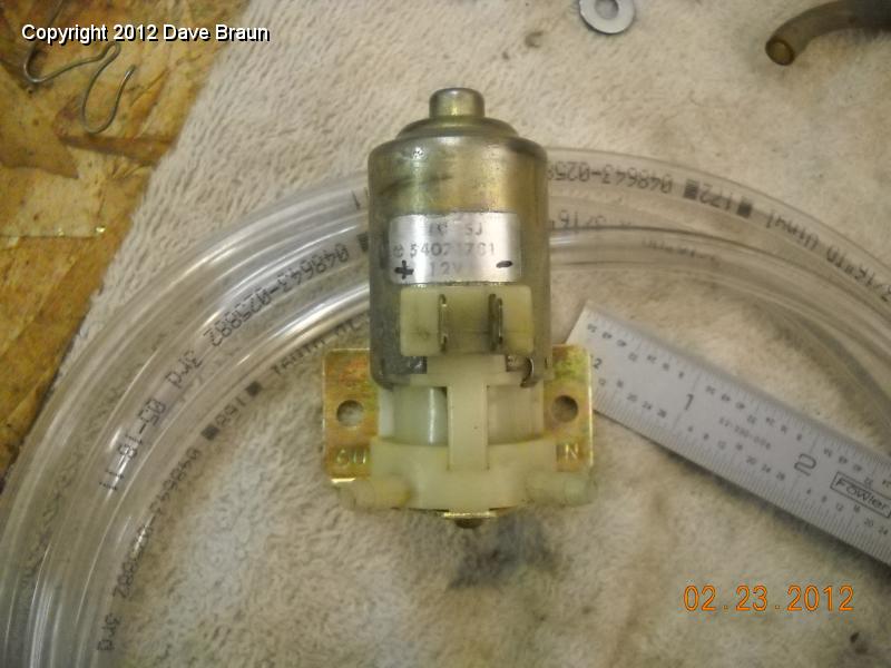 Washer pump mounted to plated bracket 01.jpg