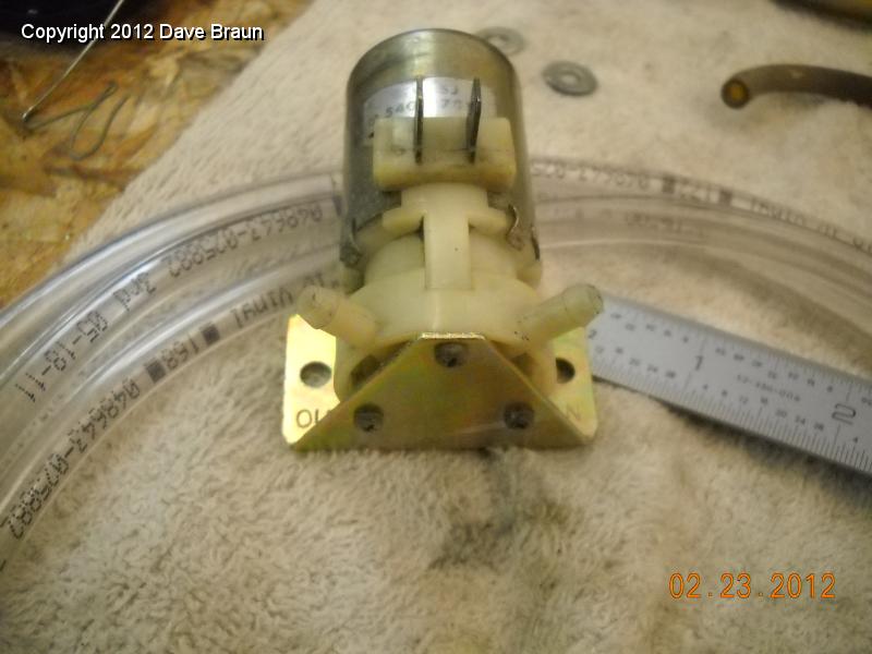 Washer pump mounted to plated bracket 02.jpg