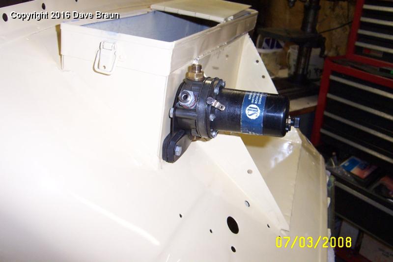 Fuel pump installed on firewall 2.jpg - The fuel pump mounted to the firewall tool box.
