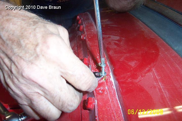 Driving in brass insert.jpg - Installing a threaded insert. Notice the locked nut to facilitate turning the insert in.
