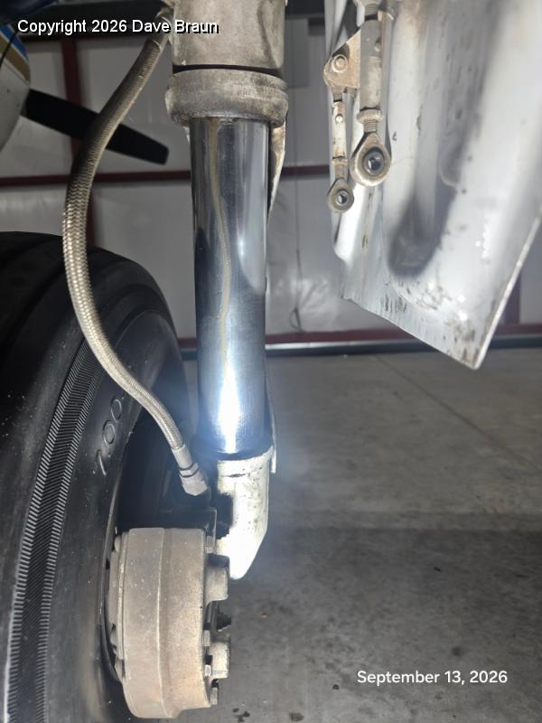 2026-09-13 14.47.57.jpg - The actual leak is visible as hydraulic fluid with the felt oil runs down past the scraper.