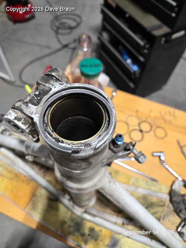 2026-09-14 13.52.01.jpg - Removing the lower snap ring, the scraper, and the piston adapter ring.