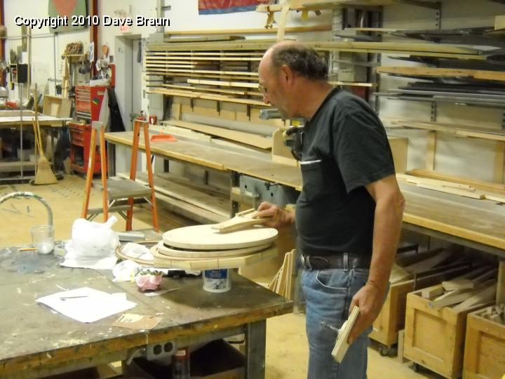 DSCN0914.JPG - Gordon in the wood shop with his steering wheel jigs.