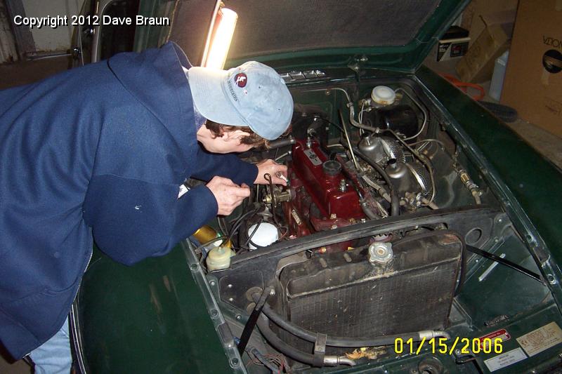 Diane installing spark plugs.JPG