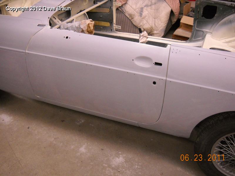 Door in place.jpg - We hung the doors to check the corner fit and to allow us to spray the sides and doors at the same time. We will be setting the boot lid and bonnet in place prior to painting.