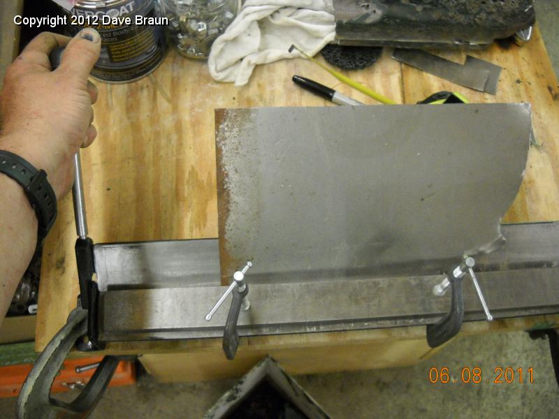 Using brake to bend patch for RH wing.jpg - Using a small brake to get some of the bends. The bends were so close together that we had to also resort to vise and hammering. This is for the RH panel.