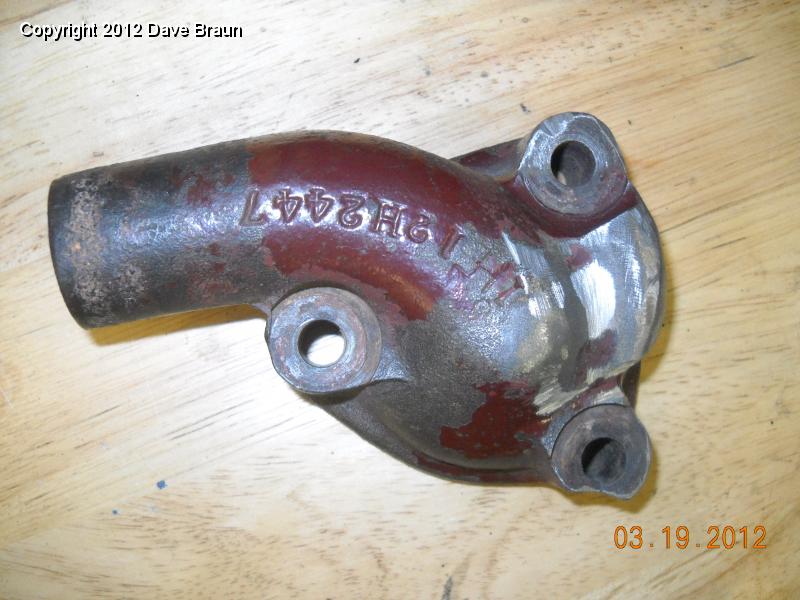 Ground off air pump bracket from water pump elbow.jpg