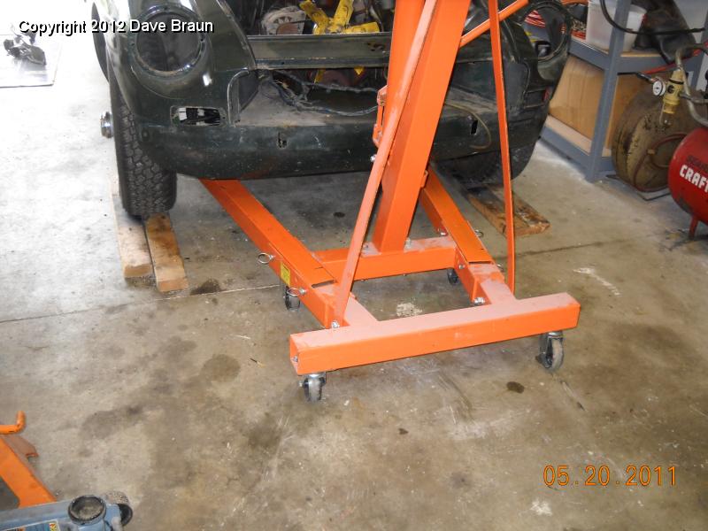 Elevating the tires to clear the height of the legs of the hoist.jpg