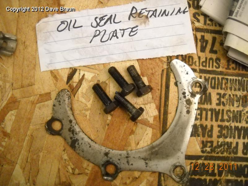 Rear seal retaining plate and bolts.jpg